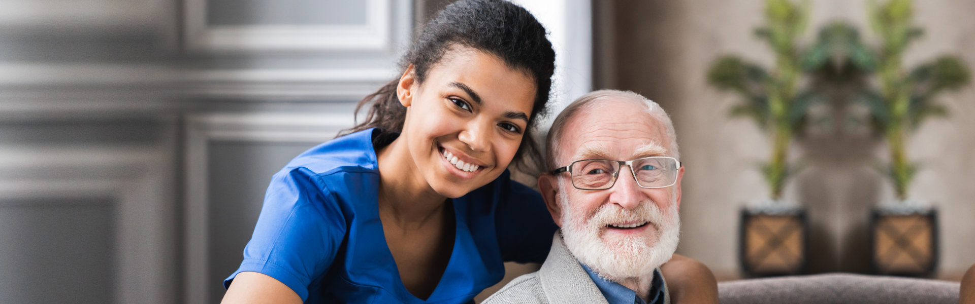 Caregiver and elderly smiling